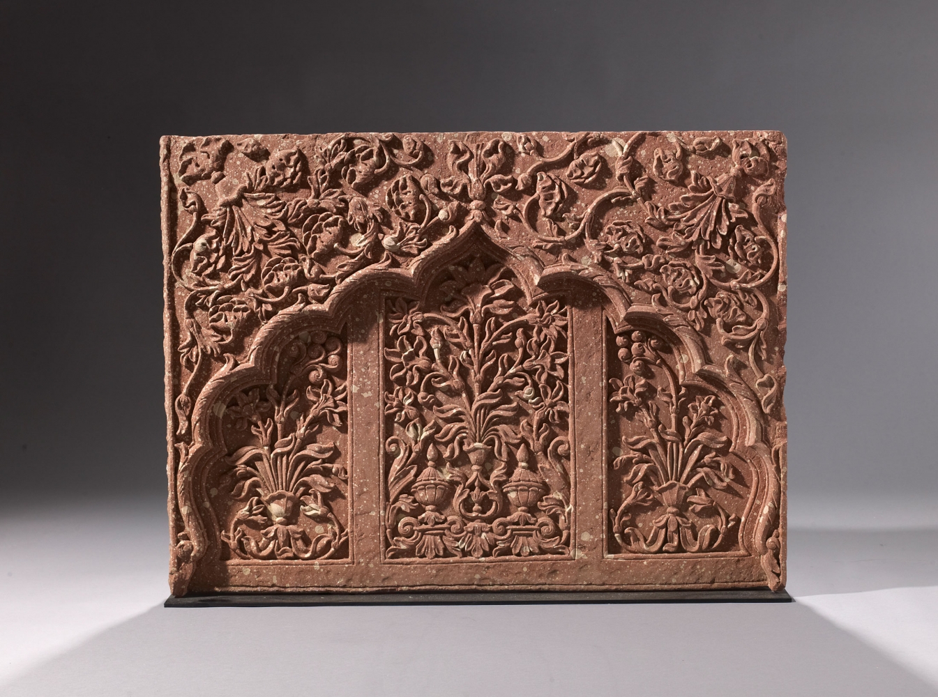A carved sandstone panel with cusped niche, c. 1680-1730