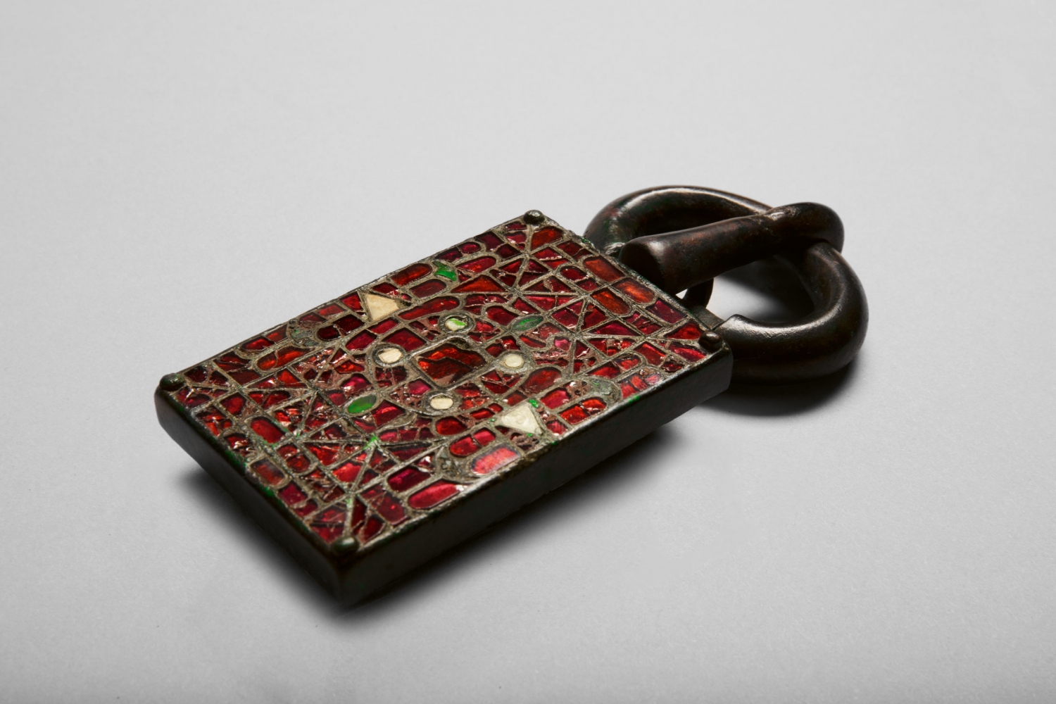 A belt buckle inlaid with garnet and glass, c. 540- 560
Visigothic Spain
Copper alloy with garnets, glass and cuttlefish bone supported by gold foils
5 1/4 x 2 3/8 x 1 inches
(13.5 x 6.1 x 2.5 cm)