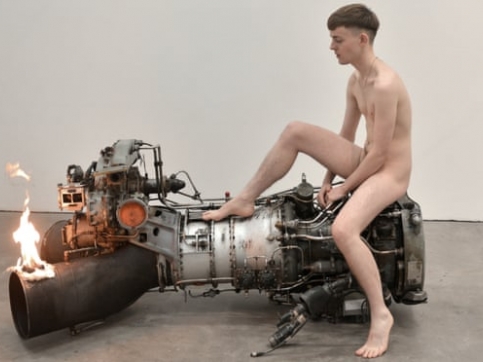 Man sitting on engine