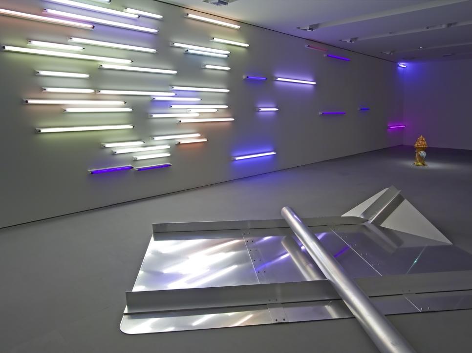 Art gallery installation of an exhibition, with a metal floor sculpture and  neon light piece
